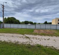 A view of the fenced plot at Warehouses and Halls in Zemianske Sady on Zemianske Sady Street.