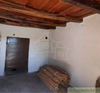 Wooden ceiling, brown doors, and a wood storage in the cabin.