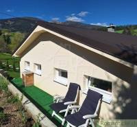 A family house in Liptovský Mikuláš with a terrace and garden, surrounded by nature.