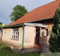 A family house in Žiar nad Hronom with a red roof and a garden.