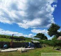 Summer atmosphere at the cottage in Veľký Krtíš with a clear blue sky and clouds.
