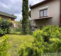 A cottage in Nové Zámky surrounded by greenery and a landscaped garden.