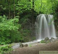 A waterfall surrounded by forest and greenery in nature near Hačava.
