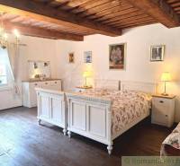 Rustic room for a family house, wooden beams, white furniture accessories, romantic decorations.