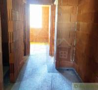 Building, interior with brick walls and flooring in a family house.
