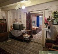 Retro living room in a family house, antique furniture and a television with decorations.