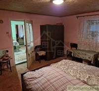 A bedroom in a traditional country house, decorations and comfortable furnishings evoke coziness.