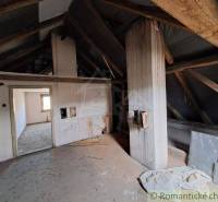 Attic and family house with wooden beams and a bright spacious interior for renovation.