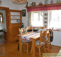 A typical cottage interior with wooden furniture and vintage decorations, ideal for a family home.