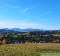 Beautiful country cottages are surrounded by meadows and gardens with views of the hills.
