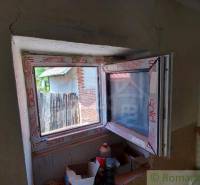Interior renovation of a family house with a newly installed plastic window.