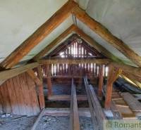 Attic with old wooden beams in the roof structure of a family house.