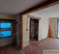The interior of a family house in the renovation phase, unfinished spaces with wooden details.