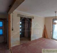 The interior of a family house under renovation with new doors and windows.