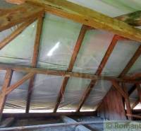 The attic of a family house with wooden beams and covering, typical for romantic cottages.