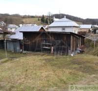 A rural plot with a wooden cottage and a garden ideal for a family house and relaxation.