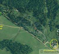 Aerial view of a 1077 m² plot next to a forest and garden in the village of Litmanová.