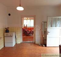 A room in a family house with retro furniture and a stove, a timeless space.