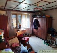 A room and a cottage with wooden cabinets and vintage decorations, cozy atmosphere.