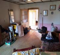 A room full of equipment and furniture in a family house, country style room.