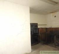 Basement space with an open chamber, missing surface finishes in a family house.