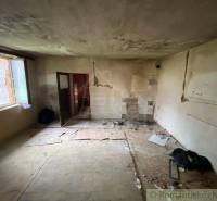 Empty room and family house with damaged walls and floors during renovation.