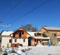 A snowy scenery with a house and tradition in winter, rural life in nature.