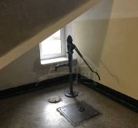 Under the staircase, there is a water pump next to the window, ideal for a 2-bedroom apartment.