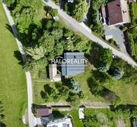 Aerial view of a family house in Nová Baňa surrounded by greenery and a garden.
