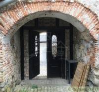 An old brick gate leads into the courtyard, unique architecture and peculiar properties.