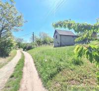A country house surrounded by greenery and an access road in Komárno, Unique properties.