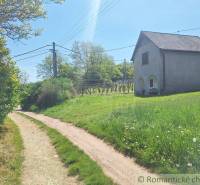 A country road and a stone house in a picturesque landscape near Komárno, Unique properties.