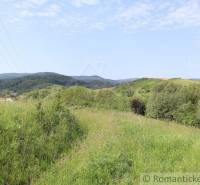 Green hills and meadows with a panoramic view, ideal for building a family house.
