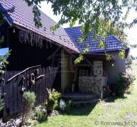 A rustic cottage surrounded by greenery, ideal for relaxation and family leisure.