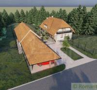 A traditional family house near the forest with a spacious yard and a farm building.