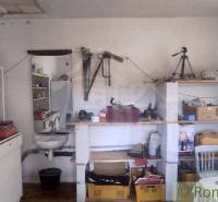 Workshop with old furniture and various tools in a family house.