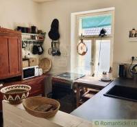 A kitchen with rustic furniture, traditional decorations, equipment, family house.