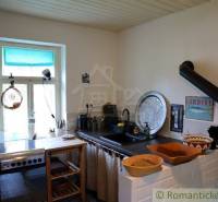 Kitchen, windows, artistic decorations, wooden elements, family house with a traditional stove.