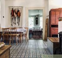 Cozy country dining room, traditional furniture and stove, ideal family home.