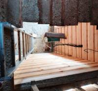 Renovation in the interior of the cottage, new wooden floors, construction work on the cabin.