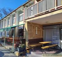 Balcony seating at commercial premises in a quiet environment with large windows.