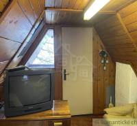 Attic wooden room, retro television, sofa set, **cottage** for a recreational stay.