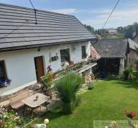 A family house with flowers and a green garden, an ideal place for relaxation.