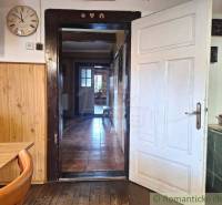 Interior of a family house with white doors and wooden furniture for a cozy atmosphere.