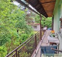 A spacious balcony with a view of the garden, ideal for relaxation within the property - living.