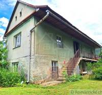 A family house with a veranda, staircase, and garden. An ideal place for peaceful living.