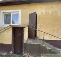 Family house with plaster, staircase, and doors.