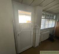 Doors and windows in the interior of a family house, radiator, cabinet.