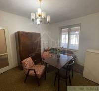 Interior of a family house with furniture, table, chairs, wardrobe, and lighting.