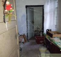 Family house, hallway with decoration and old furniture, needs renovation and maintenance.